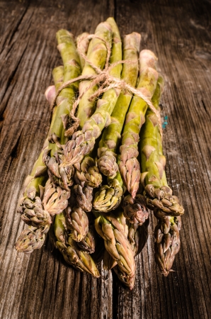 bounch of asparagus on woodの写真素材