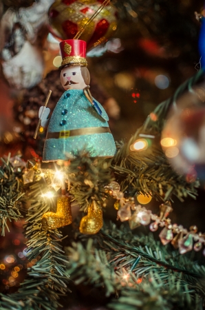 Christmas decoration on the tree  with red hat and golden boots  Star lights effectの写真素材