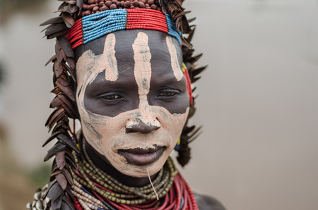 TURMI, Ethiopia, August 12: Unidentified Karo woman wearing natural ornaments in Turmi, Ethiopia,...