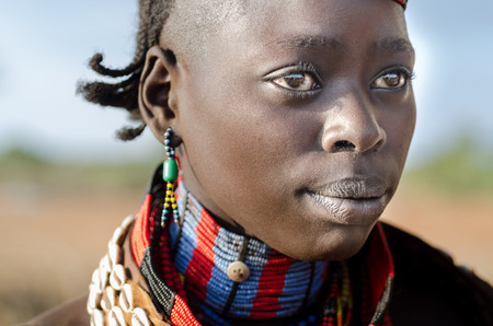TURMI, ETHIOPIA - 12 AUGUST: portrait of unidentified Hamer tribe woman, Omo valley, 12 august 2014. Hamer woman usualy comb their hairs with soil and wear many colored necklaceのeditorial素材