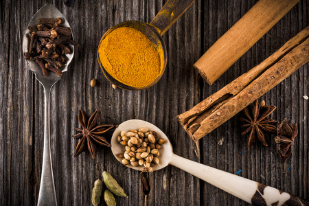 Mixed spices on a wooden tableの写真素材