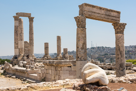 Ancient ruins of a roman temple in the Citadel of Amman. The hand of a statue in the foregroundの写真素材