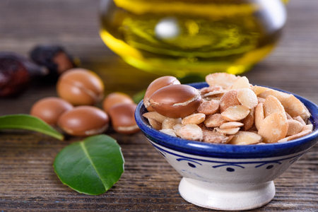 Close up of Argan fruits and oil with leavesの写真素材