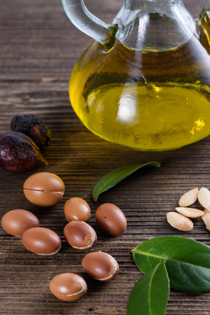 Close up of Argan fruits and oil with leavesの写真素材