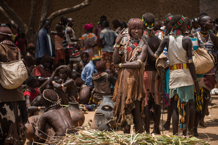 TURMI, ETHIOPIA - AUGUST 17,2015: Hamer tribe woman at the weekly market of Turmi, south Ethiopia, Omo Valley. This is the biggest market in the area.のeditorial素材
