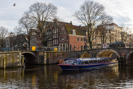 AMSTERDAM, THE NETHERLANDS - JANUARY 20, 2017:  Amsterdam, has more than one hundred kilometers of canals, about 90 islands and 1,500 bridges. The three main canals, Herengracht, Prinsengracht, and Keizersgrachtのeditorial素材