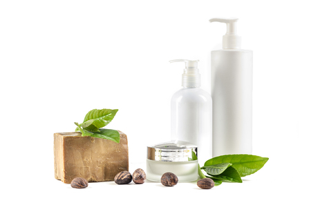 Shea Butter nuts on white with cosmetic products, soap, cream and oil or gel.の写真素材