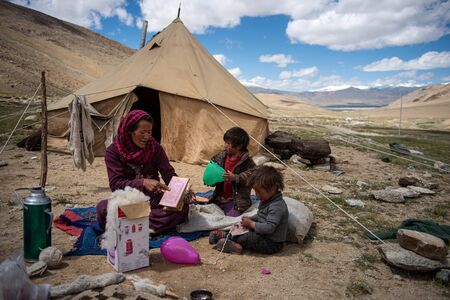 Woman carding wool fibers in Ladakhのeditorial素材