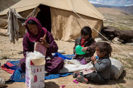 Woman carding wool fibers in Ladakhのeditorial素材