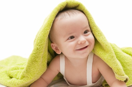 beautiful baby with a towel over your headの写真素材