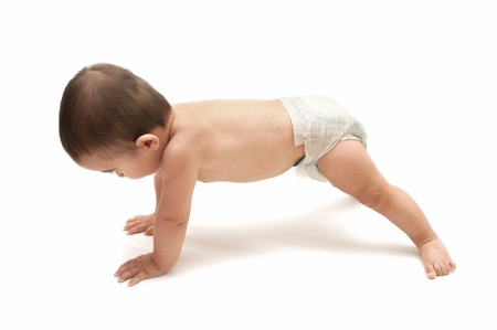 beautiful baby doing push ups isolated on white backgroundの写真素材