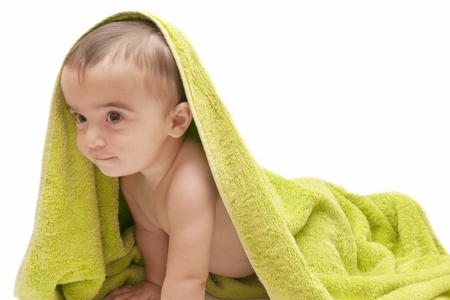 beautiful baby with a towel over your headの写真素材