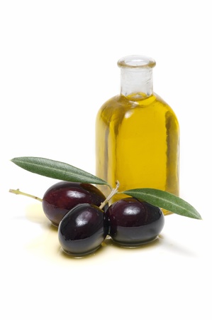 olive oil and fresh olives on white backgroundの写真素材