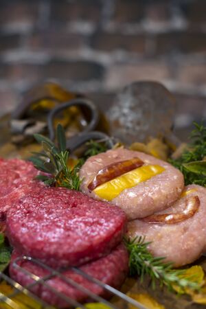 Fresh veal burgers prepared to be grilled on the grillの写真素材