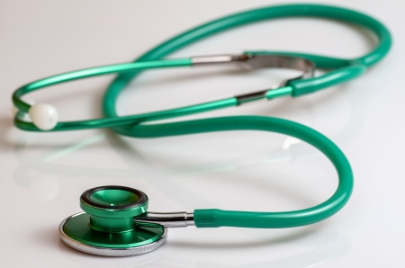 green stethoscope on the white backgroundの写真素材