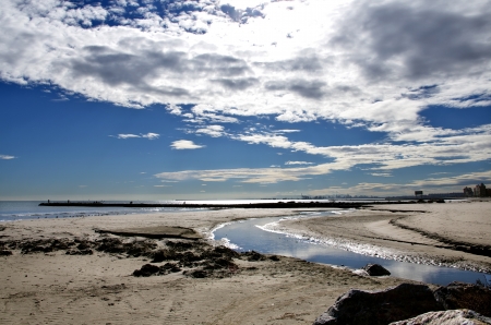 photograph of the mouth of the river on the beachの写真素材
