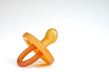 macro photograph of a silicone pacifier on white background