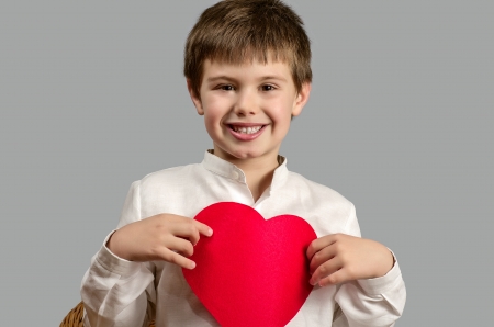 studio photography of a child with a heart of Valentineの写真素材