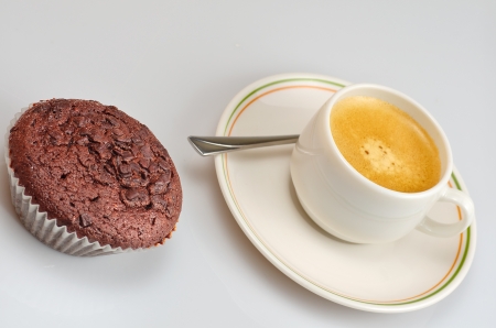 picture of a chocolate cupcake and a coffeeの写真素材