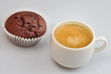 picture of a chocolate cupcake and a coffeeの写真素材