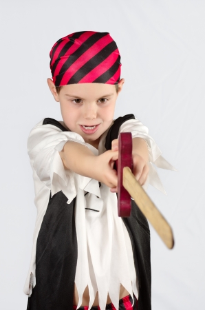  a child dressed as pirate over gray backgroundの写真素材