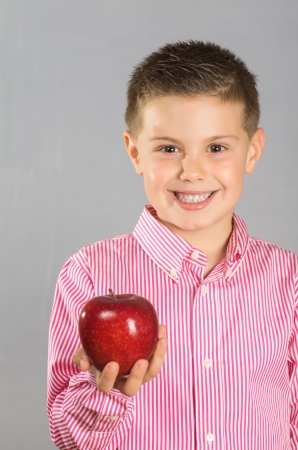 photograph of a child posing with apples variedの写真素材