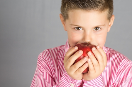 photograph of a child posing with apples variedの写真素材