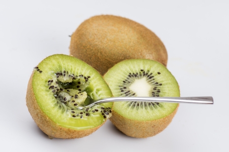macro newly harvested kiwifruit on white backgroundの写真素材