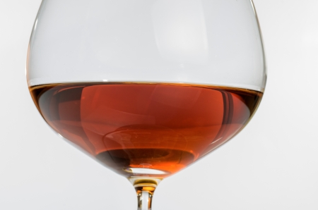 macro photograph of a glass of brandy on white backgroundの写真素材