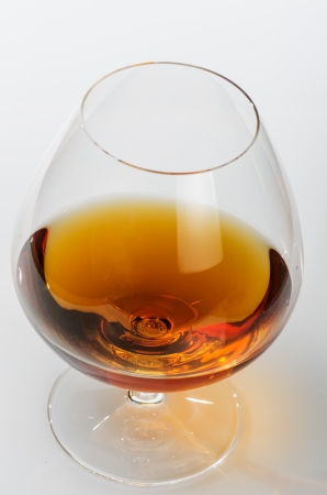 macro photograph of a glass of brandy on white backgroundの写真素材