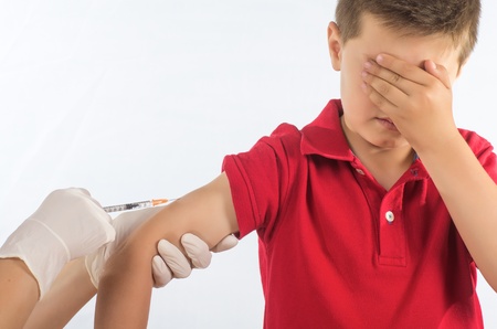 a doctor vaccinating a childの写真素材