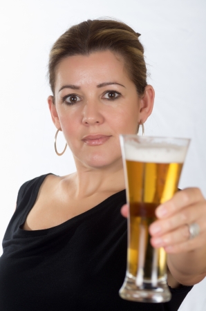 portrait of a woman drinking beer on white backgroundの写真素材