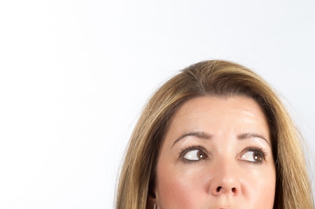 half face of a real woman staringの写真素材