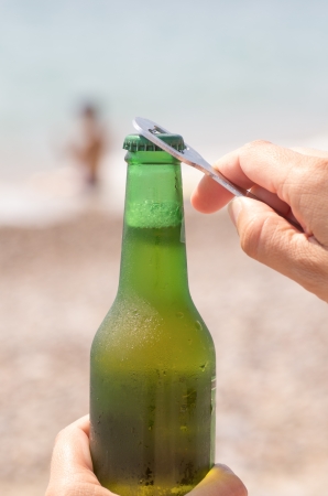 macro photography of a beer with a beach backgroundの写真素材
