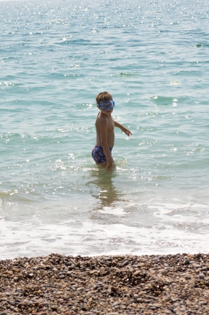 picture of a child playing on the beachの写真素材