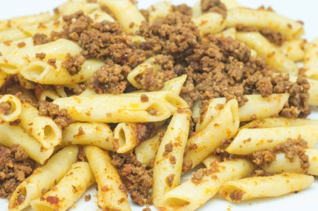 macro photograph of a plate of macaroni with bologneseの写真素材