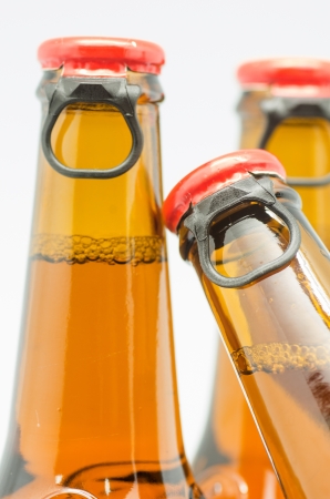 macro photograph of bottles of beer on white backgroundの写真素材