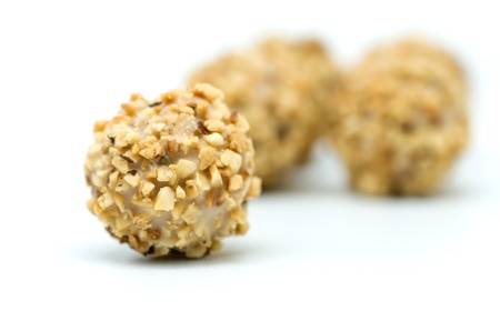 macro photography chocolates with almonds on white backgroundの写真素材