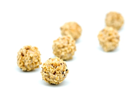 macro photography chocolates with almonds on white background