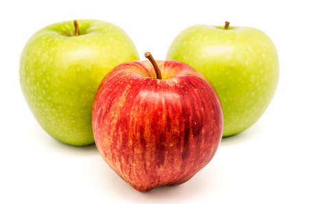 photograph of a hand picking apples to chooseの写真素材