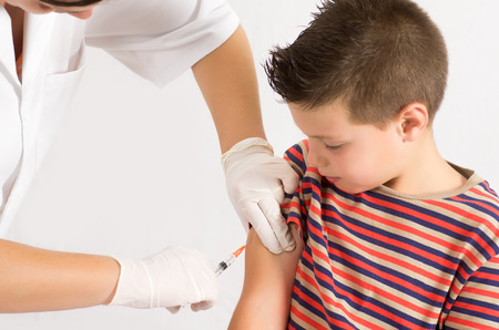 macro photograph of a doctor vaccinating a childの写真素材