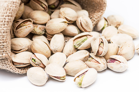 product photography a jar full of pistachios on white background glassの写真素材
