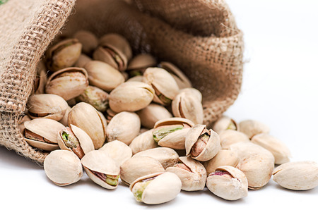 Product photography of a bag of pistachios on white backgroundの写真素材