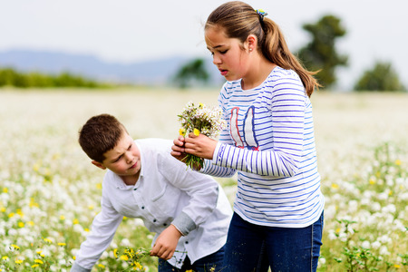children playing with her dog on the prairie