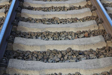 Close up of train tracks with stones between the sleepersの写真素材