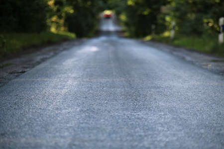 Asphalt road after the rain in the eveningの写真素材