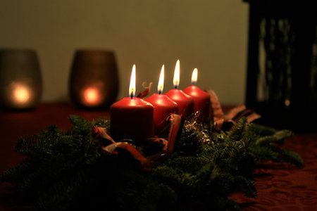 close up of an Advent arrangement with four burning candles