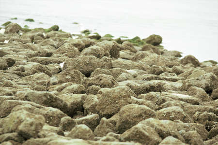 Close up of a stone pier at the North Sea