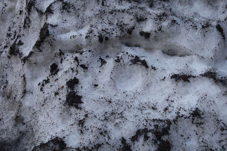 A close up of congested polluted snow