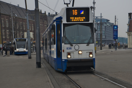 a tram in amsterdam near main stationの写真素材